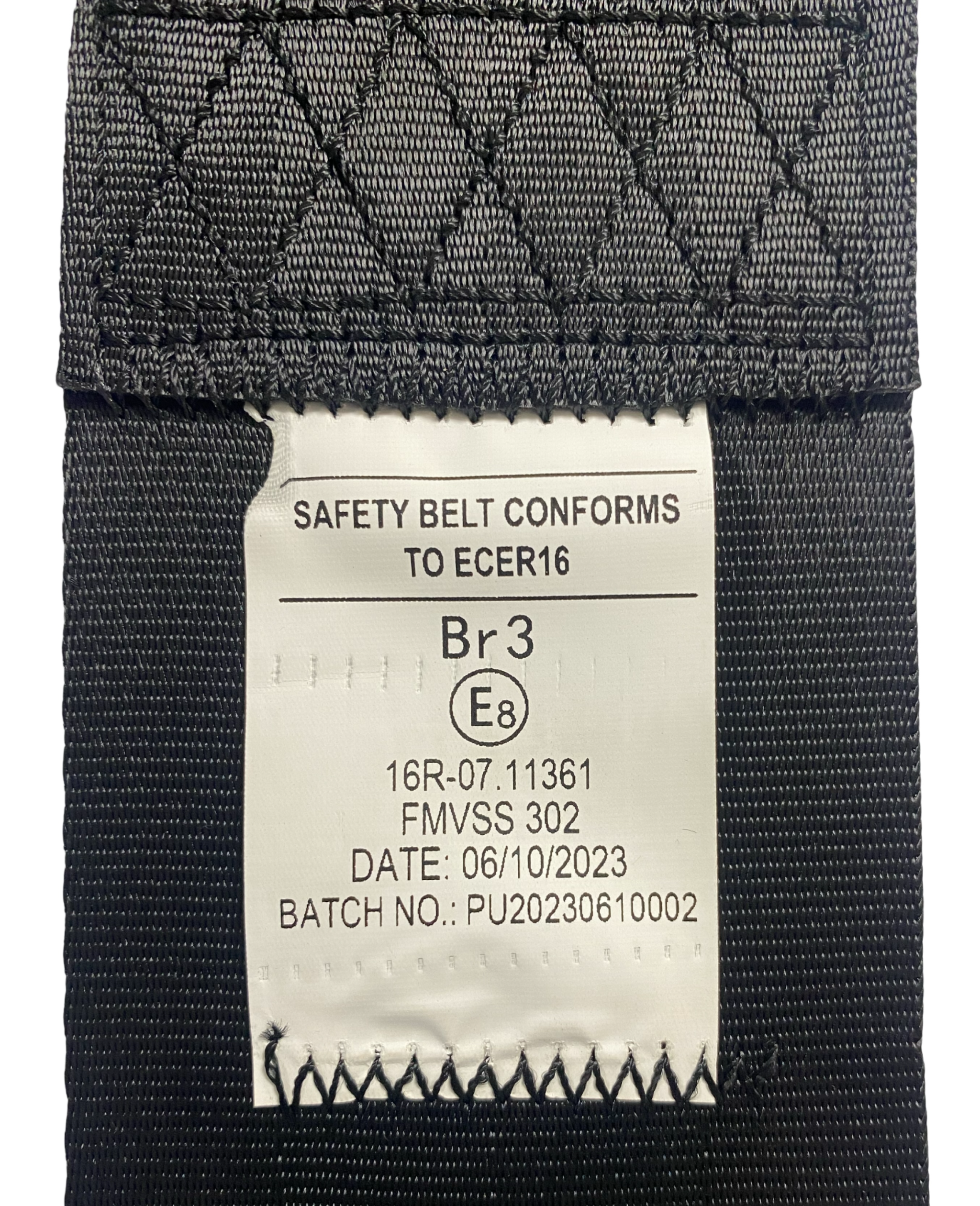 View of SA230 Black retractable lap seatbelt label showing seatbelt has been tested and certified to EU standard ECE R16 and FMVSS 302 safety compliance.