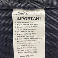 View of 3-inch non-retractable lap seatbelt label showing it is certified for Off-Road Use – Compliant with FMVSS No. 209/302 and SAE No. J386 safety standards.