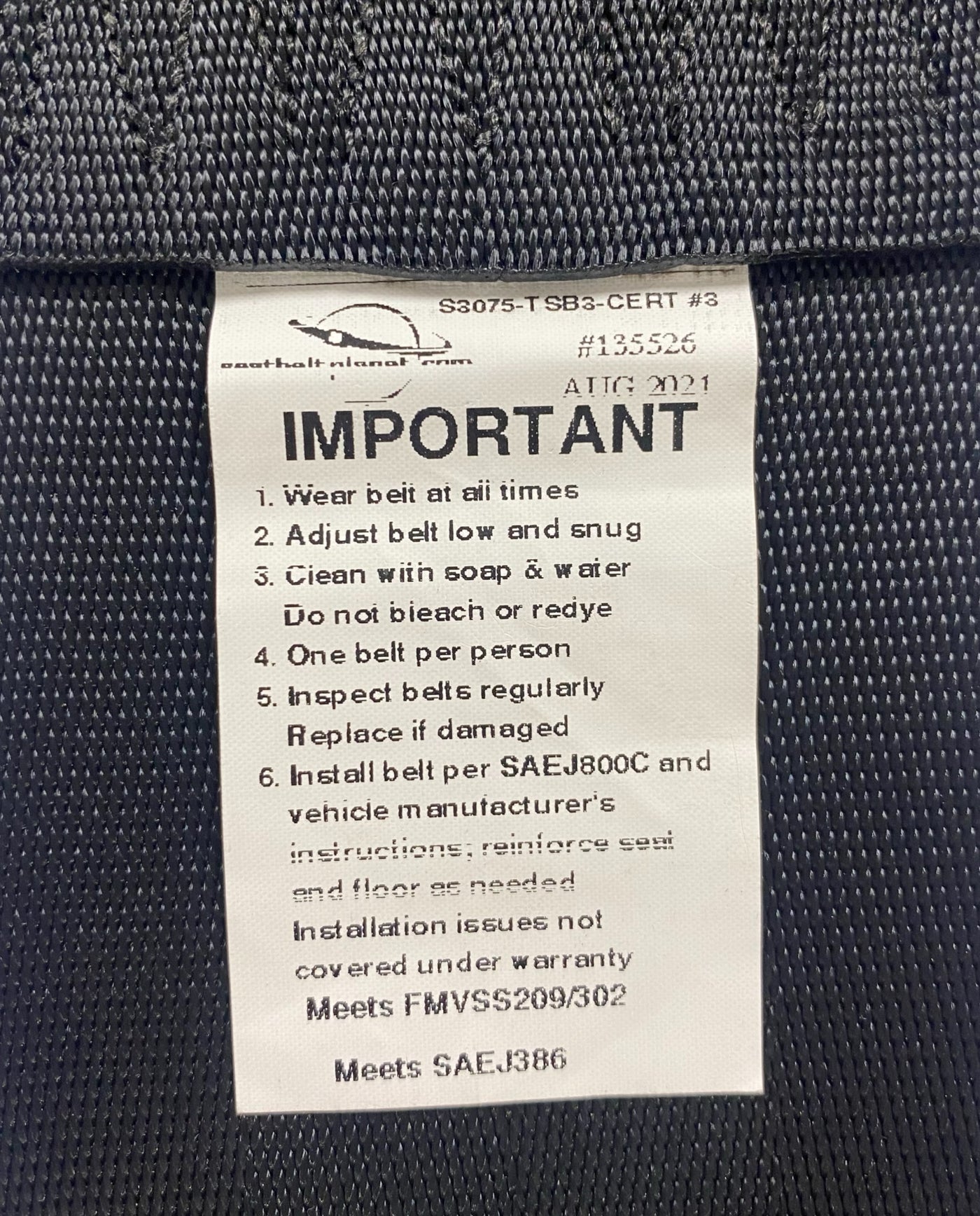 View of 3-inch non-retractable lap seatbelt label showing it is certified for Off-Road Use – Compliant with FMVSS No. 209/302 and SAE No. J386 safety standards.