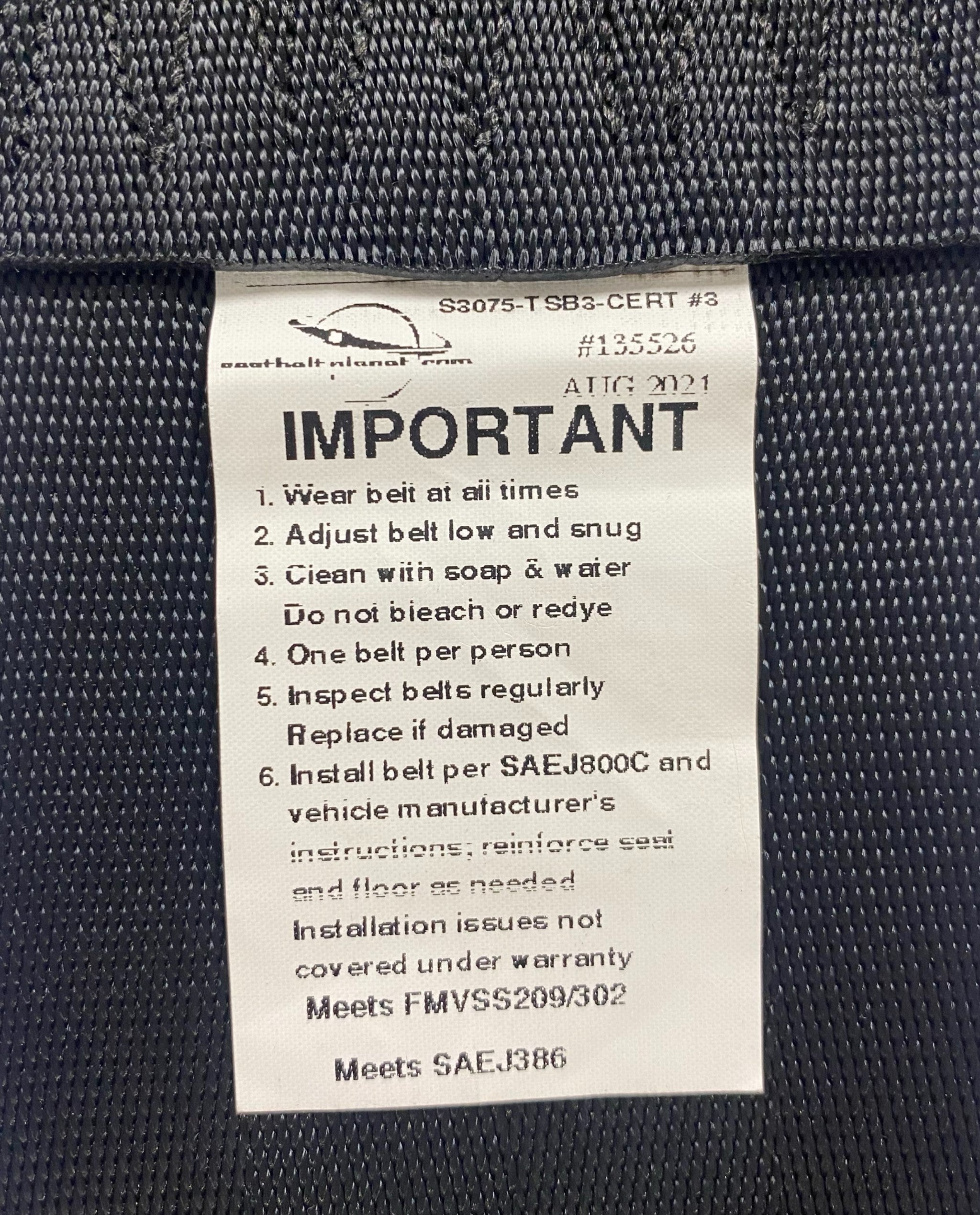 View of 3-inch non-retractable lap seatbelt label showing it is certified for Off-Road Use – Compliant with FMVSS No. 209/302 and SAE No. J386 safety standards.