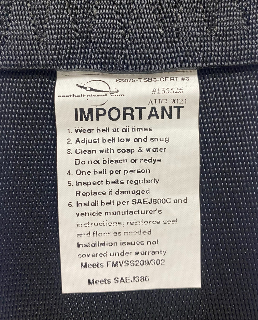 View of 3-inch non-retractable lap seatbelt label showing it is certified for Off-Road Use – Compliant with FMVSS No. 209/302 and SAE No. J386 safety standards.