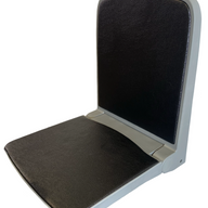 Side view of plastic flip-up seat in open position – space-saving design with gas strut support for boats, machinery, and public transport