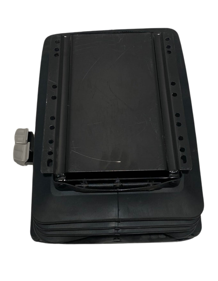 Underside view of SC-BASE mechanical suspension seat base showing multiple floor mounting holes for universal fitment